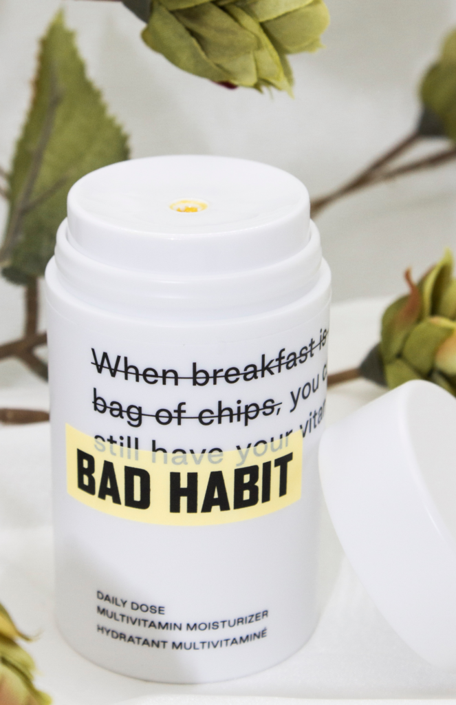 Close-up of Bad Habit Daily Dose Multivitamin Moisturizer product packaging.