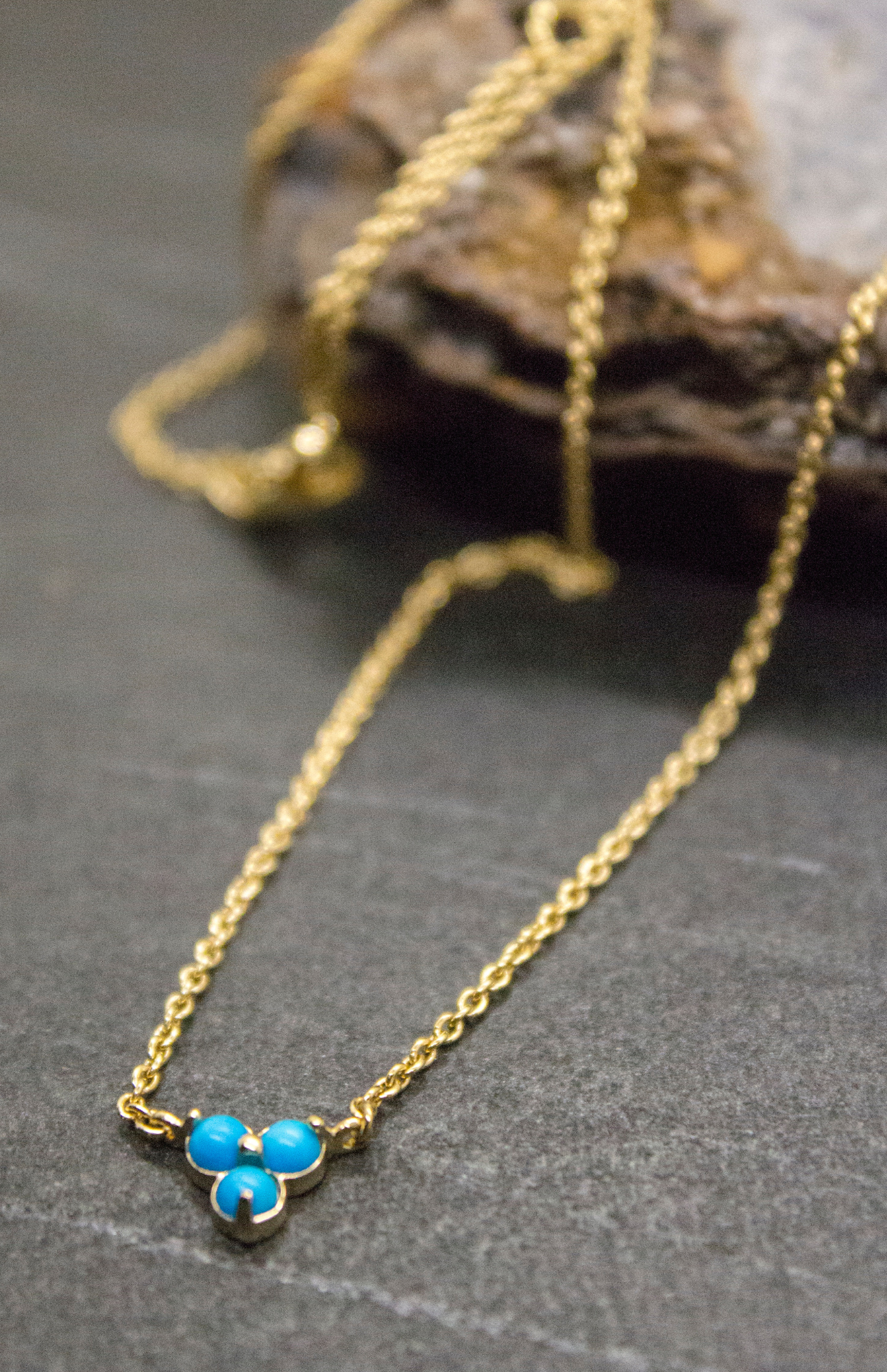 Delicate Birthstone Jewelry Turquoise Lotus Necklace from Mejuri Jewelry.