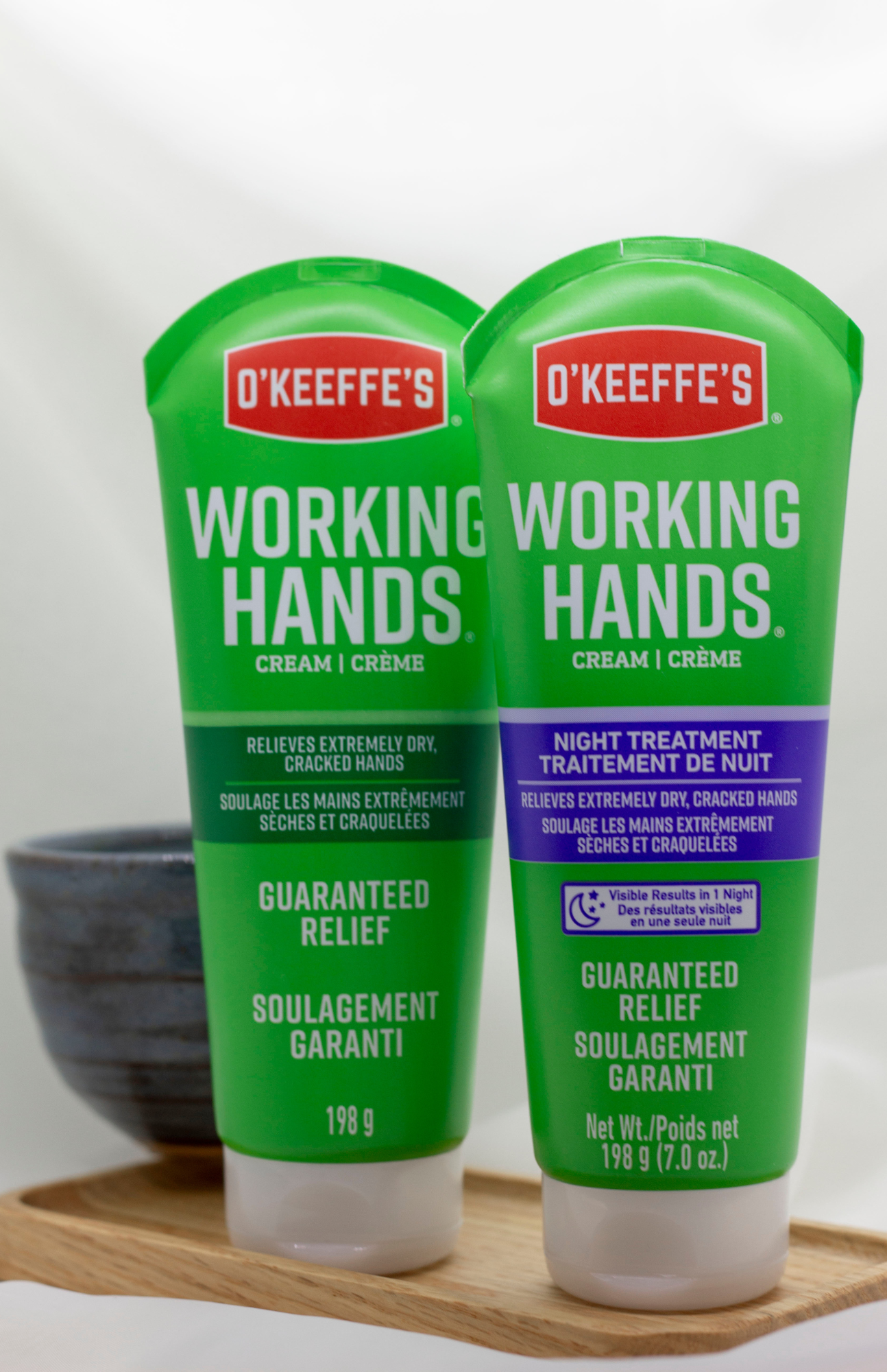 Two bottles of O'Keeffe's Working Hands Hand Cream, showcasing the 'day' and 'night' treatment variations.