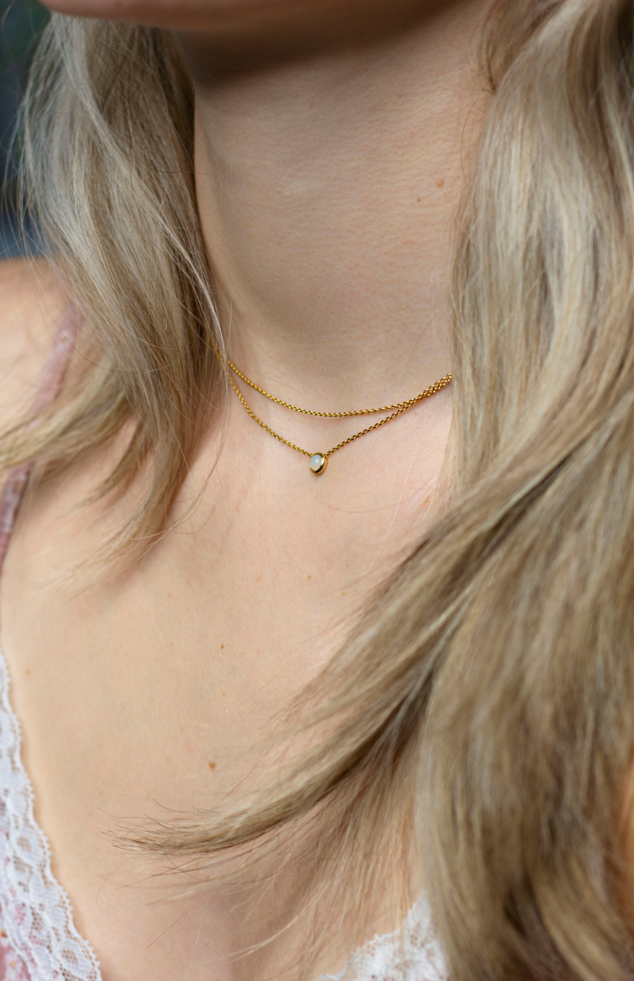 Layered Gold Vermeil Necklace featuring a Floating Opal Stone on an Infinity Symbol Design.