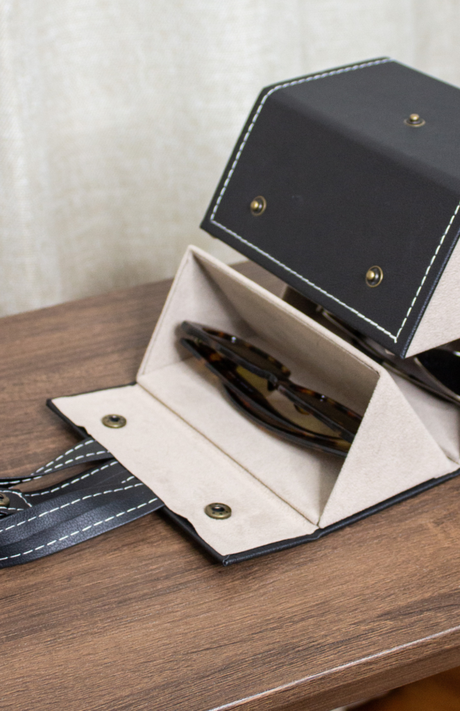 Partial view of the Livtor Sunglasses Organizer in a semi-closed state, offering a glimpse of the sleek design and efficient eyewear storage. Closed-up presentation captures the elegance and functionality of this stylish eyewear organizer with neatly arranged sunglasses.
