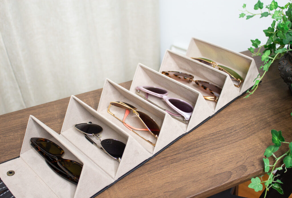 Close-up view of the Livtor Sunglasses Organizer, showcasing an elegant and efficient eyewear storage solution. Neatly organized sunglasses within the organizer, highlighting both style and functionality.