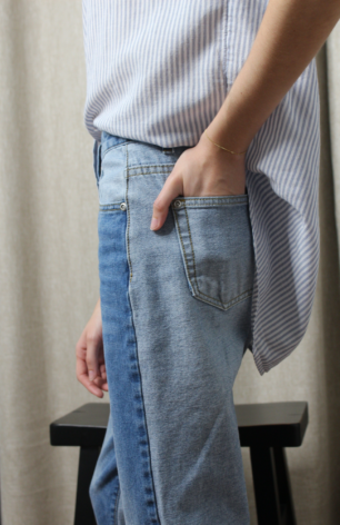 Content creator in Monochromatic Fashion Jeans and Light Blue Striped Shirt.