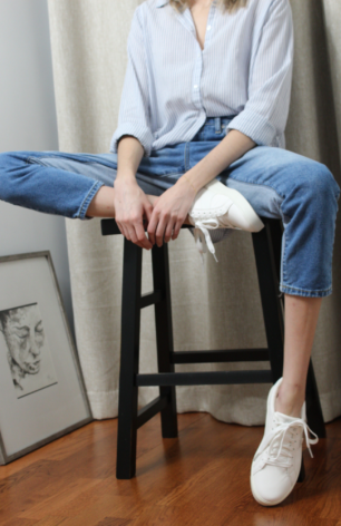 Close-up of Content Creator in Light Blue Striped Shirt - Monochromatic Fashion.