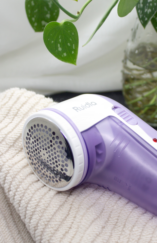 Image displaying the Ruidla Fabric Shaver Defuzzer for a closet refresh, an electric lint remover equipped with a stainless steel honeycomb cover, featuring a smooth surface and USB charging.