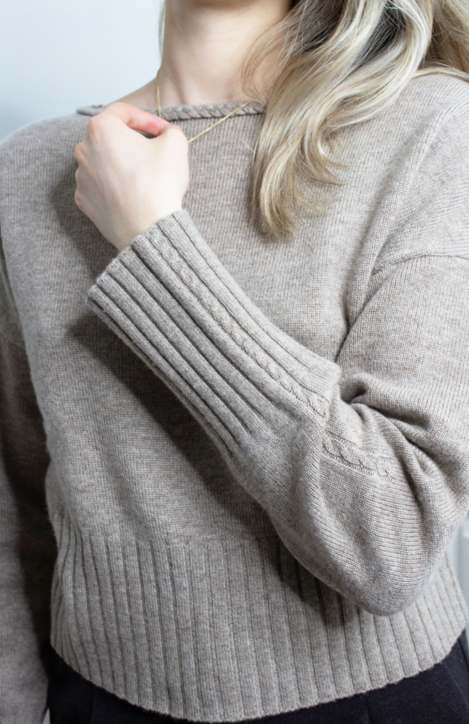 Close-up image showcasing the intricate details of the LILYSILK Braided Collar Wool and Cashmere Blend Sweater. The simplicity of the sweater contrasts with its unique handcrafted twisted cable design along the collar edges.