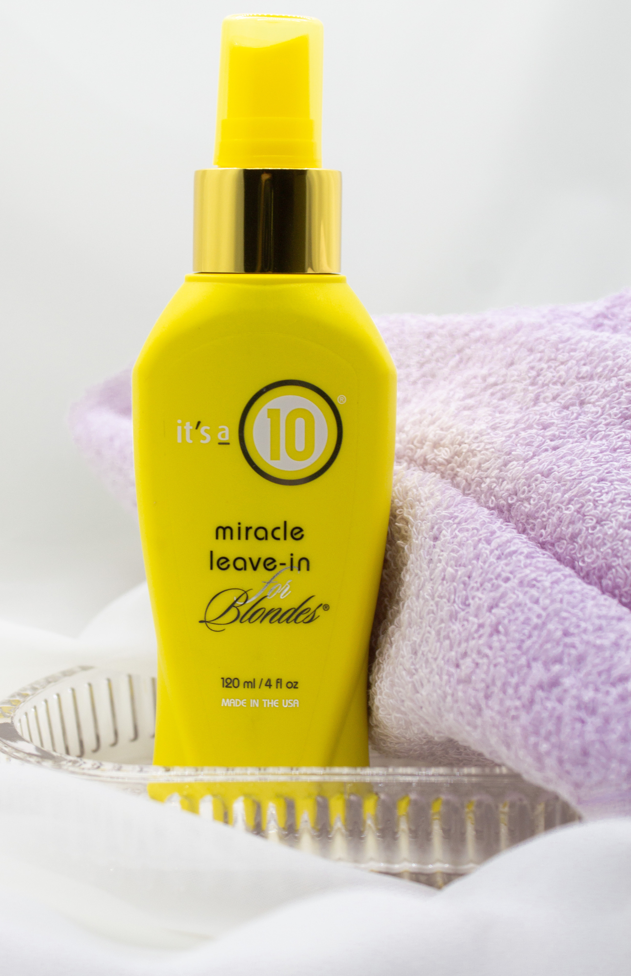 Bottle of It’s a 10 Miracle Leave-In for Blondes product beautifully displayed against a neutral backdrop.