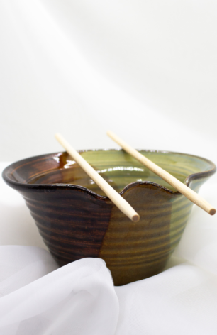 Handcrafted pottery collection from Appalachian Spring, highlighting unique bowls, trays, and vases in a variety of sizes, shapes, colors, and textures.