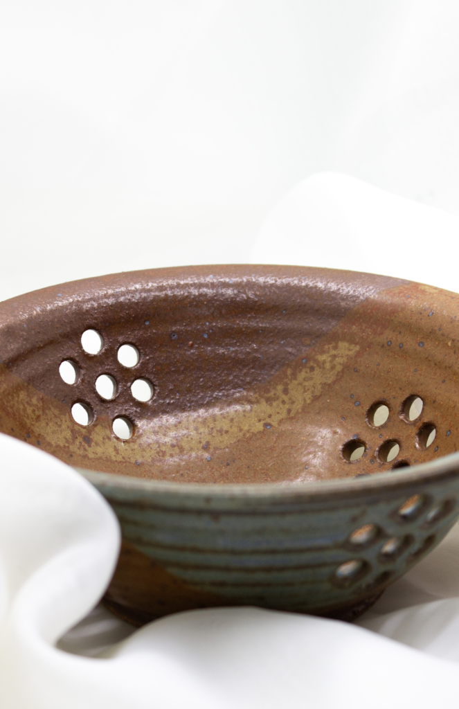 Handcrafted pottery collection from Appalachian Spring, highlighting unique bowls, trays, and vases in a variety of sizes, shapes, colors, and textures.