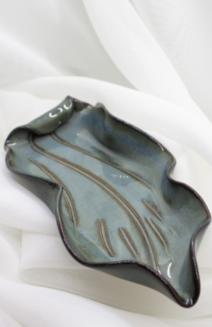 Handcrafted pottery collection from Appalachian Spring, highlighting unique bowls, trays, and vases in a variety of sizes, shapes, colors, and textures.