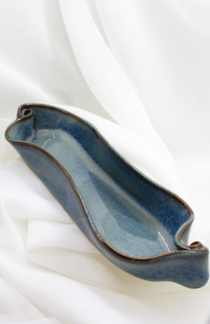 Handcrafted pottery collection from Appalachian Spring, highlighting unique bowls, trays, and vases in a variety of sizes, shapes, colors, and textures.