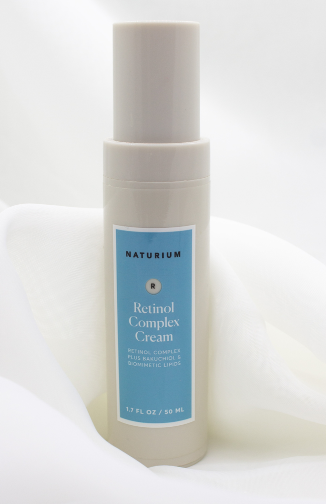 Naturium Retinol Complex Cream bottle displayed on a soft white background, highlighting its sleek blue label and elegant design, emphasizing the product's premium and soothing aesthetic. Nighttime Skincare.