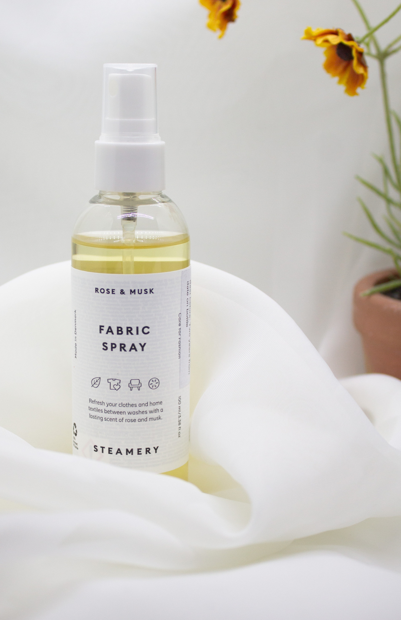 Steamery fabric freshener spray for refreshing and softening clothes.